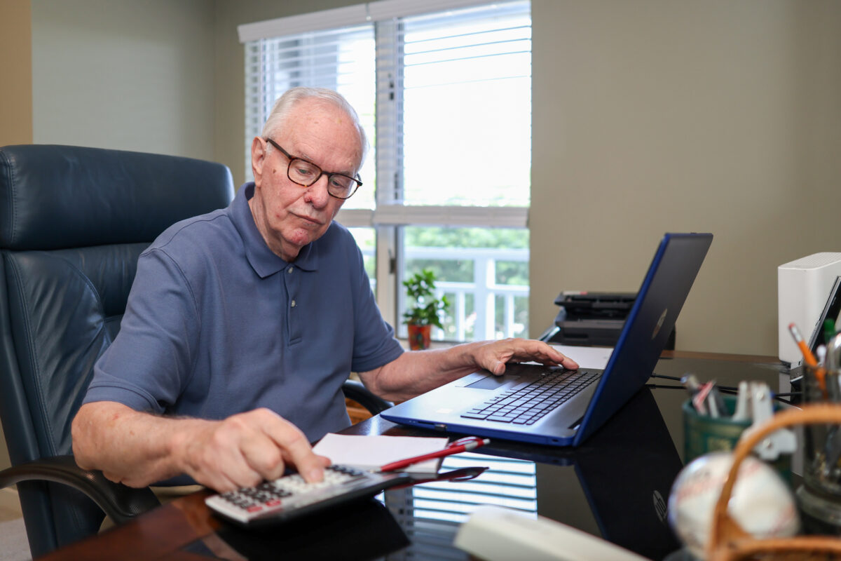 resident John Flaherty in his home office at New P:ond Village.