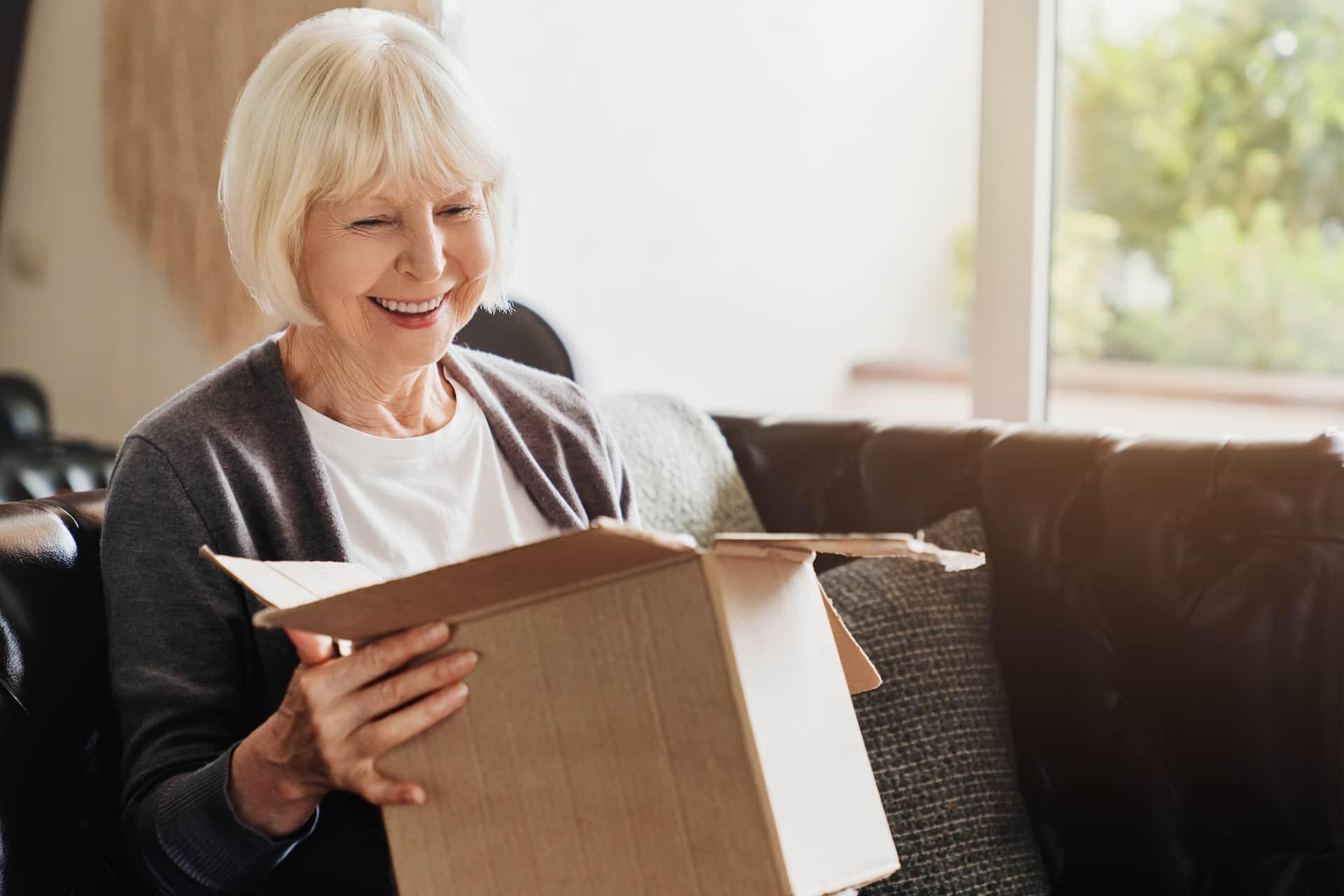 Woman packing box for moving