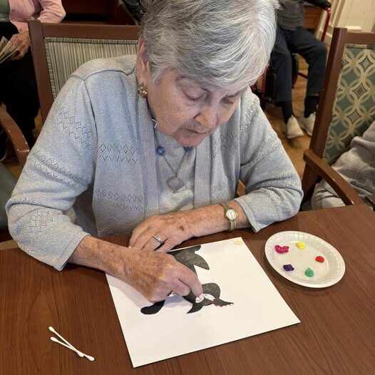 Senior woman painting