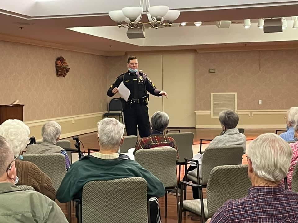 Police officer presenting to seniors