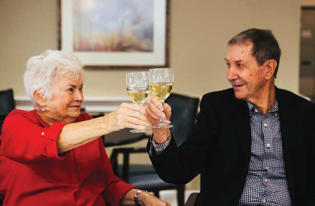 Senior couples toasting drinks