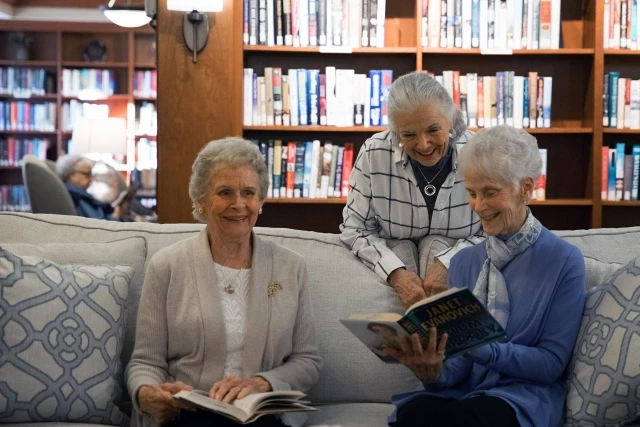 Senior women reading in library