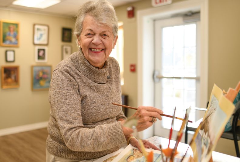 interior art resident women painting easel