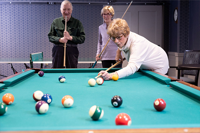 Residents playing pool