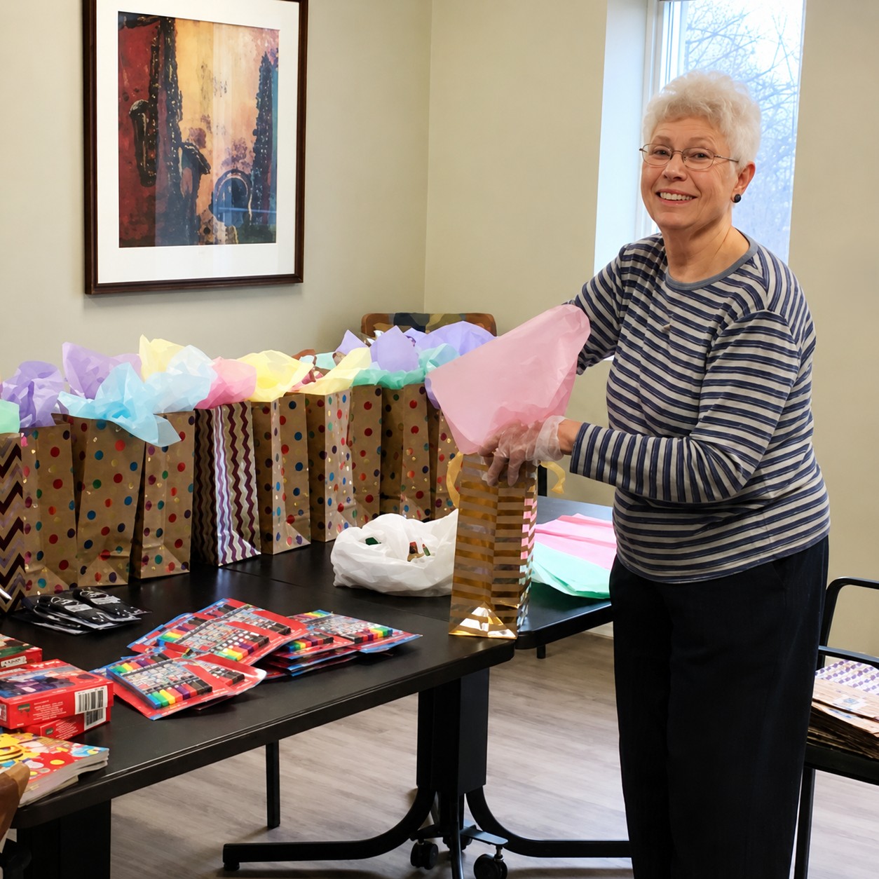 Resident volunteer Shirley Hutchins prepares colorful gift bags while helping organize the New Pond Village Country Store, where resident volunteers keep everyday essentials stocked and create a welcoming gathering place for neighbors.