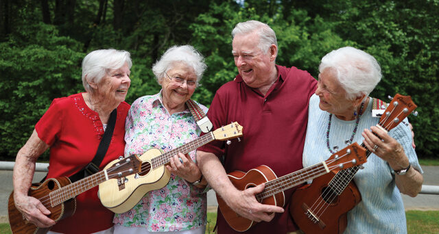 Senior living in Massachusetts means making meaningful connections being made in our ukulele club.