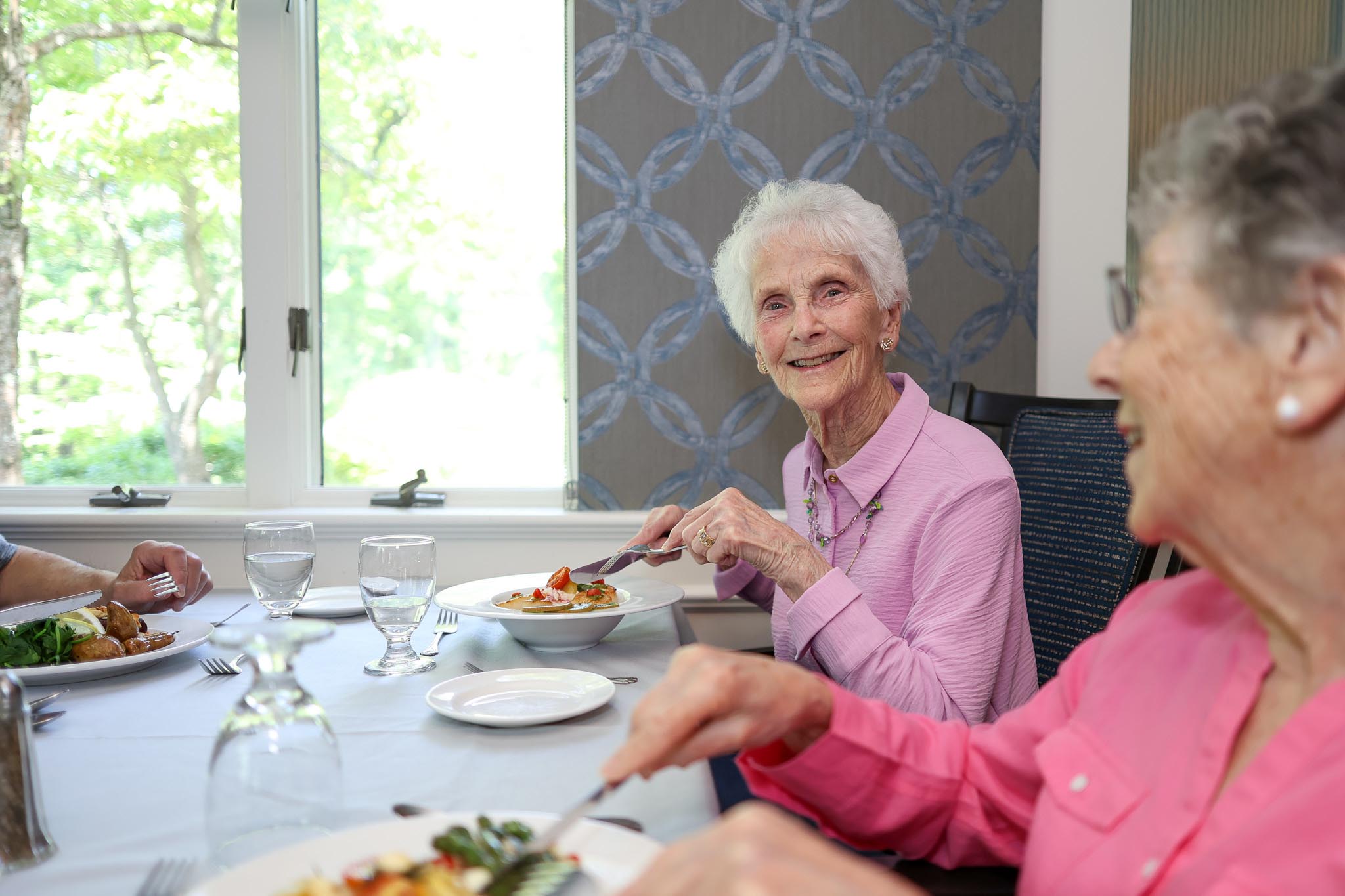 Resident Mary enjoying dinner