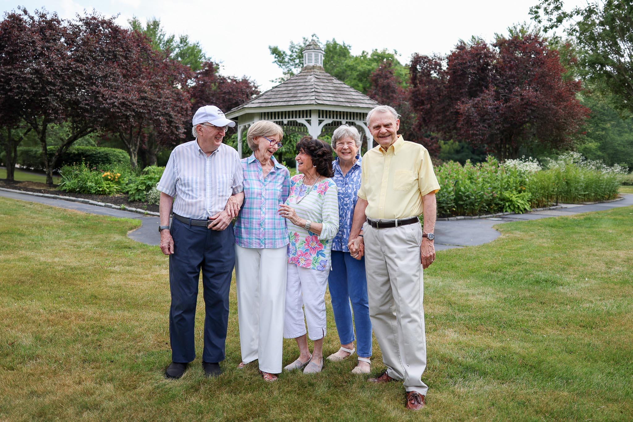 Group of residents walking outside by the gazebo