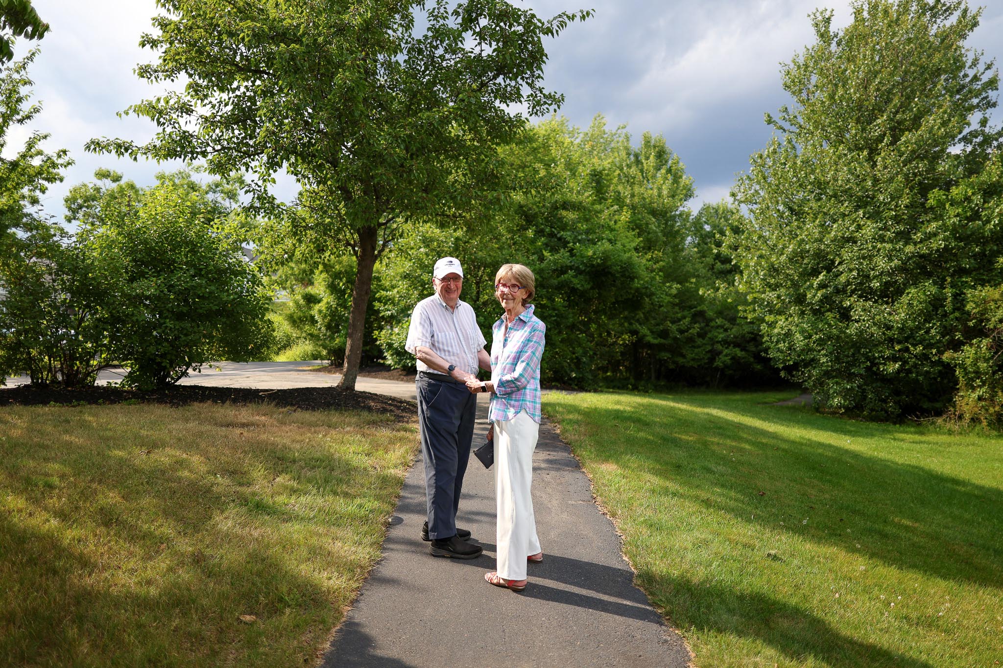 Residents John and Pat on the walking trail outside