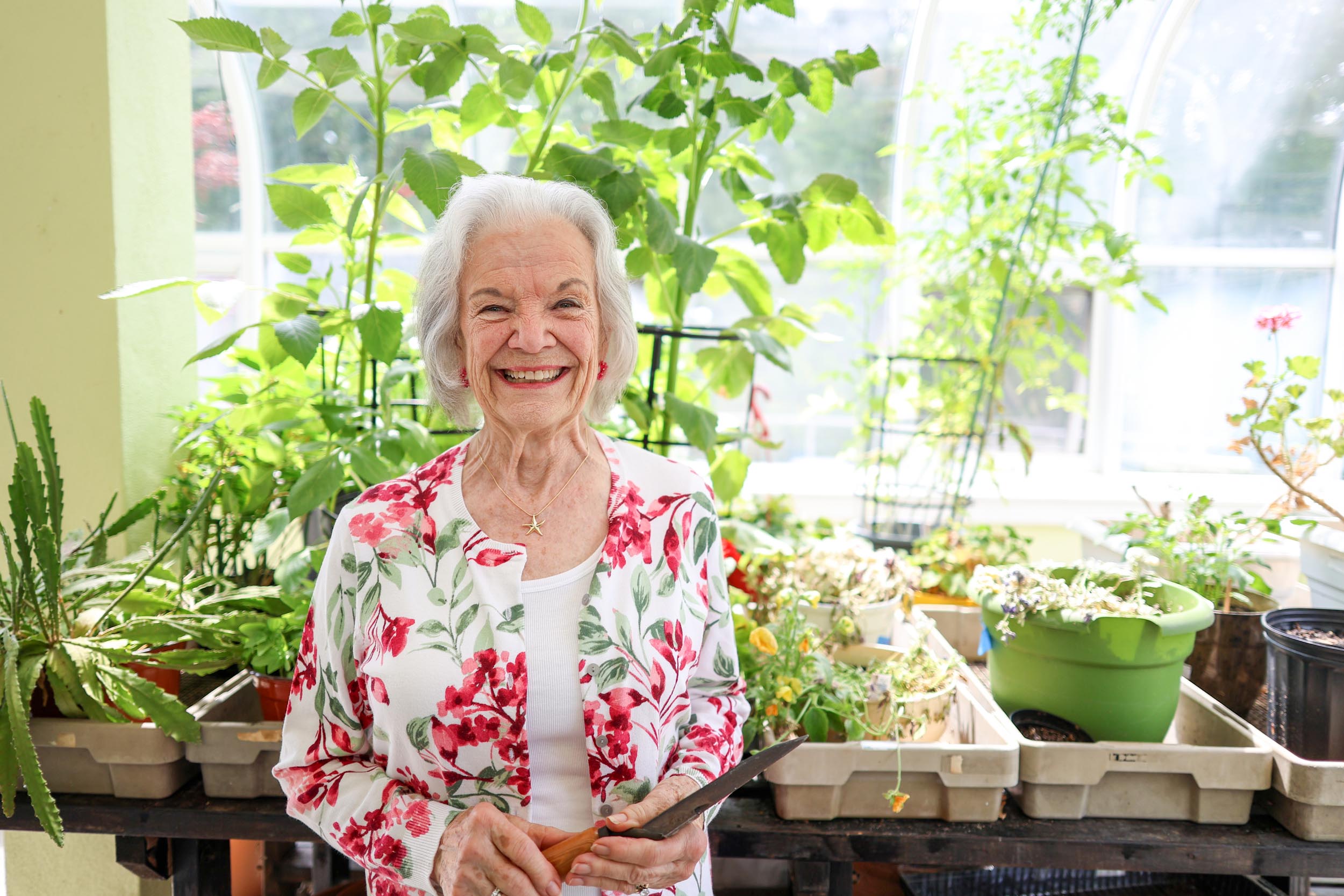 Resident Celeste in the greenhouse