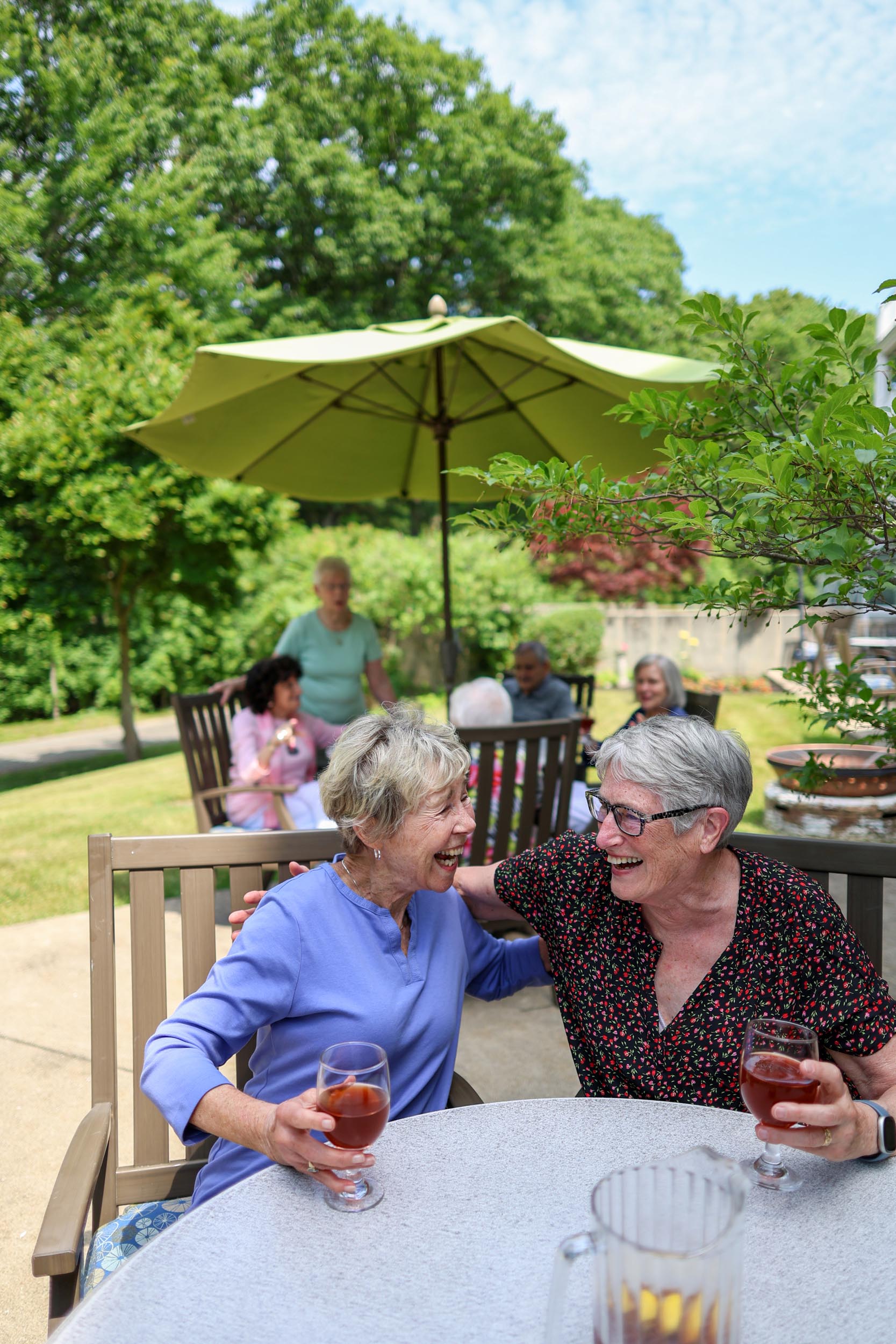 Residents enjoying tea on the patio