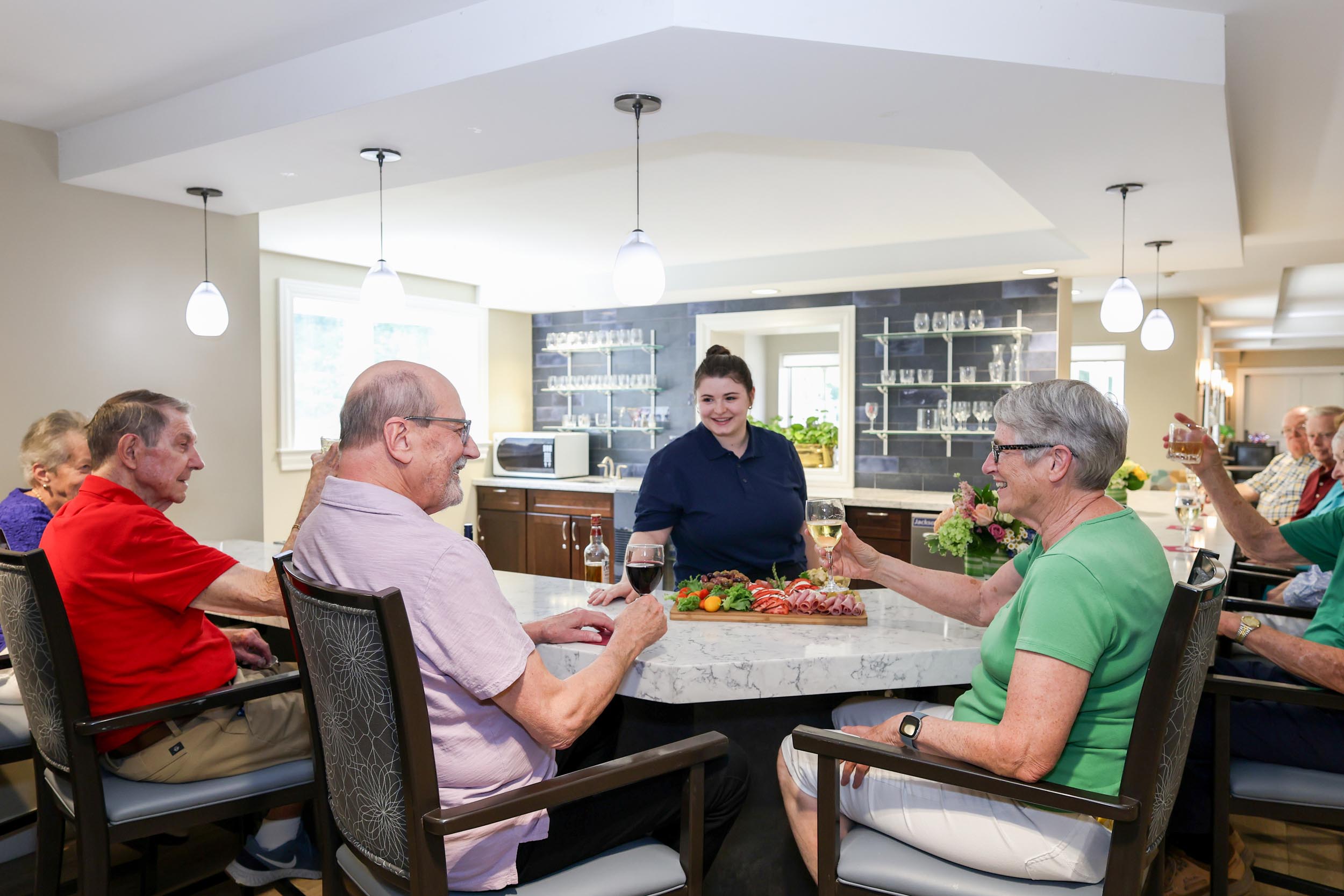 Residents and associate bartender gathered at the Village Bar