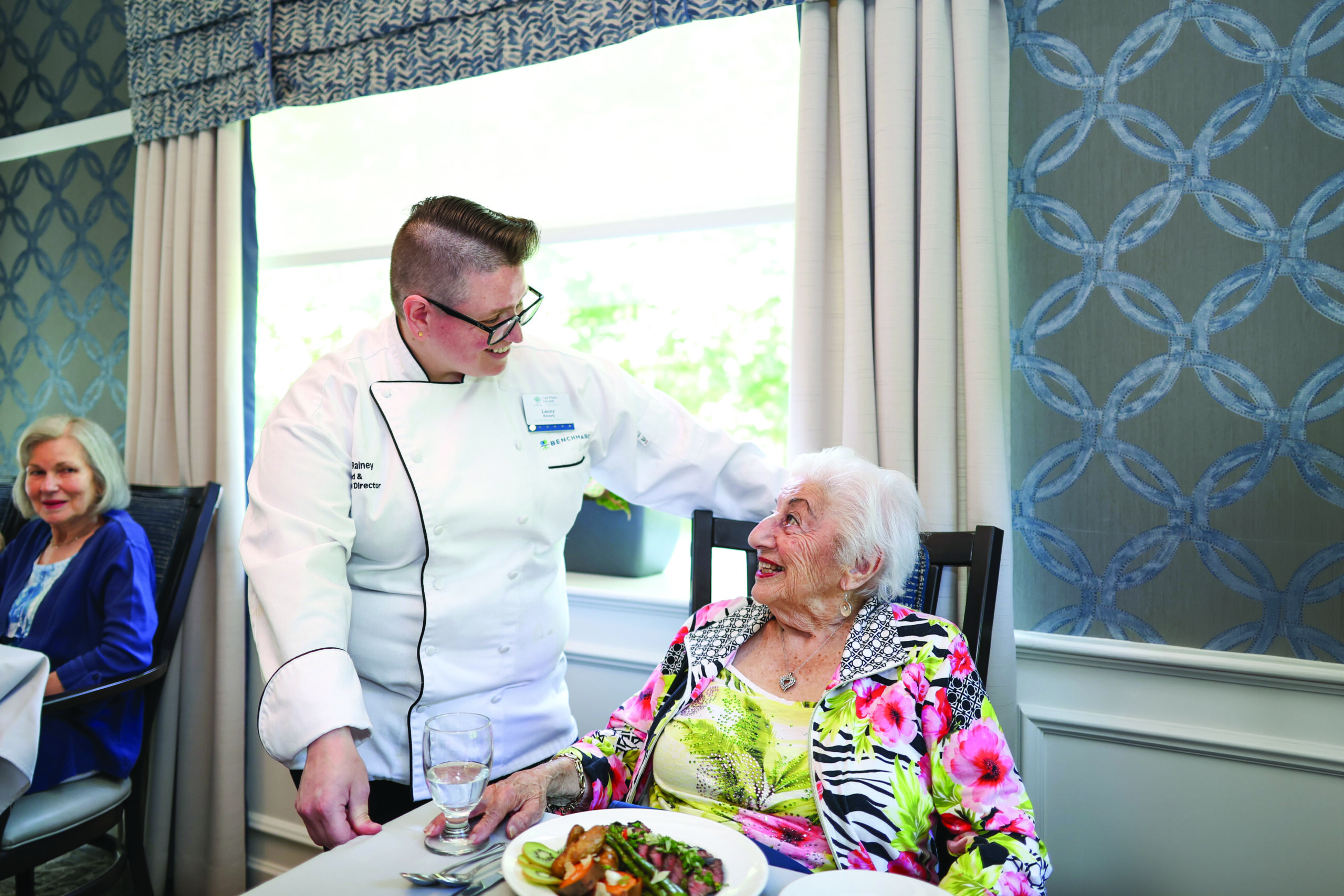 Chef Lacey with a resident dining